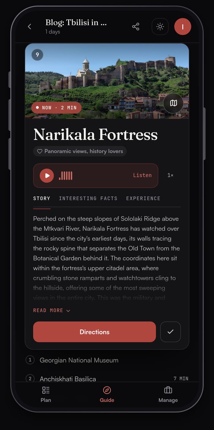 Passage AI Guide card for Narikala Fortress with a photo of the fortress walls above Old Tbilisi, a Listen button, Story, Interesting facts and Experience tabs, a Directions button and the rest of the day's stops below