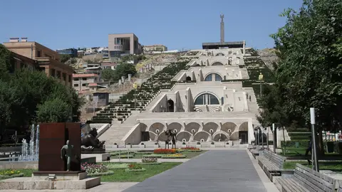 The Cascade in Yerevan, white limestone stairs and terraces climbing the hill, seen from the sculpture garden at its foot